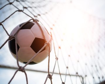 Soccer into goal success concept